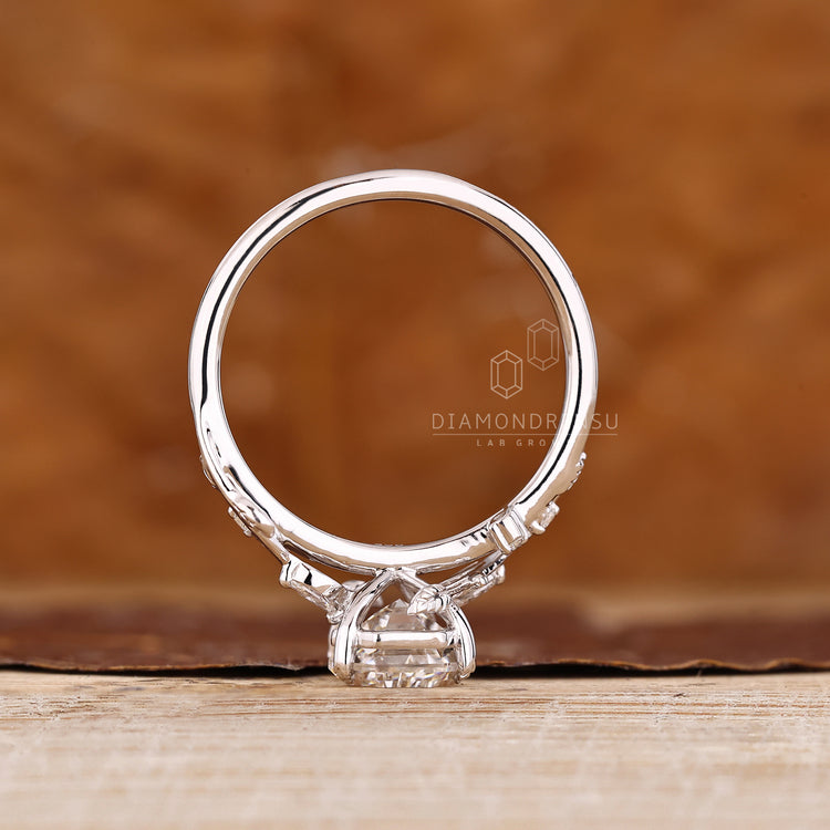 Coffin cut ring with marquise stones and twisted band style.