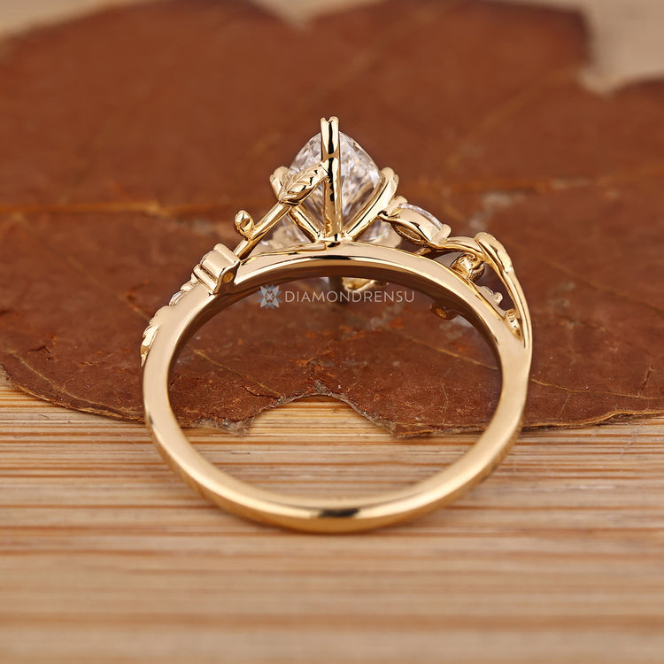 Handmade marquise ring with cathedral setting and filigree details.