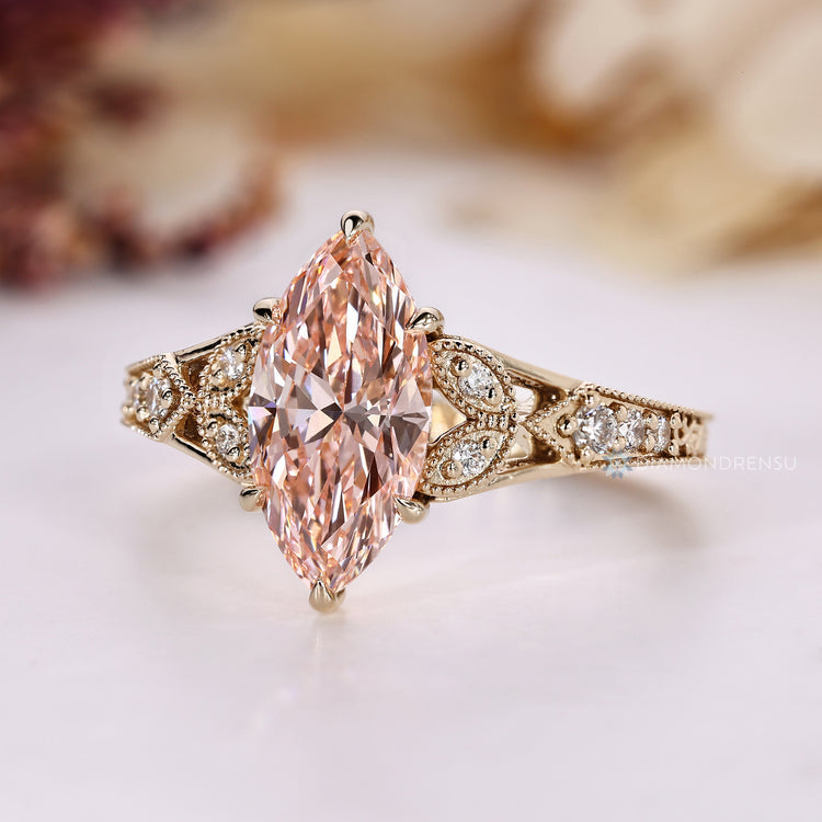Milgrain details paired with a vintage style marquise ring.