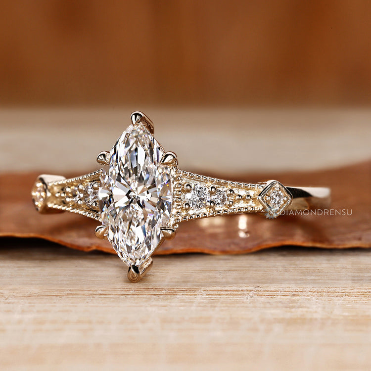 Diamondrensu marquise ring with lab grown diamond center.