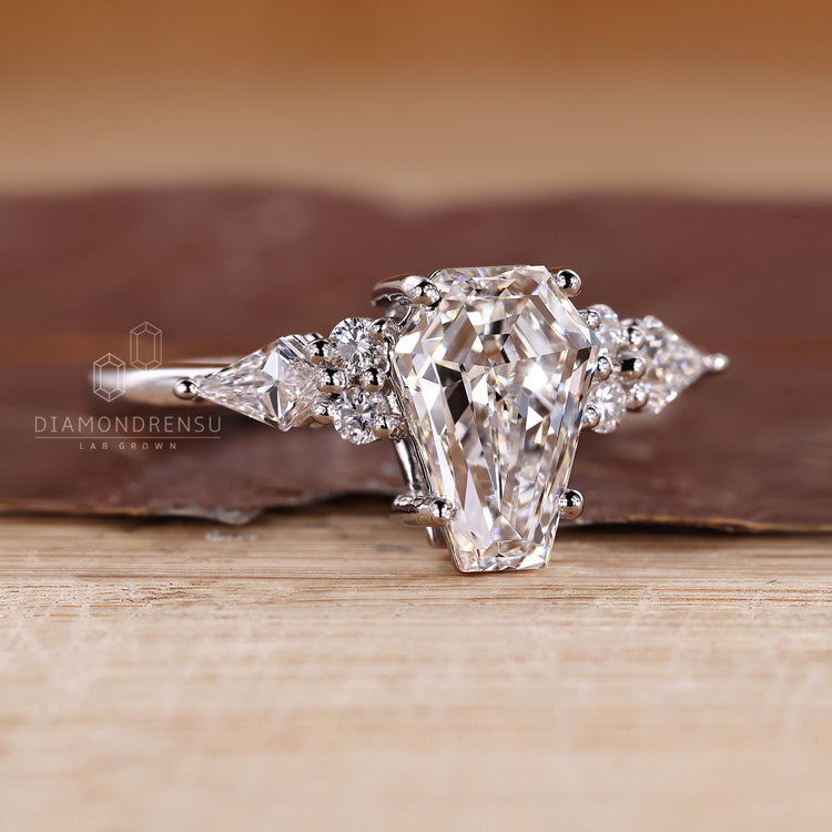 IGI certified coffin cut diamond ring with four prong setting.