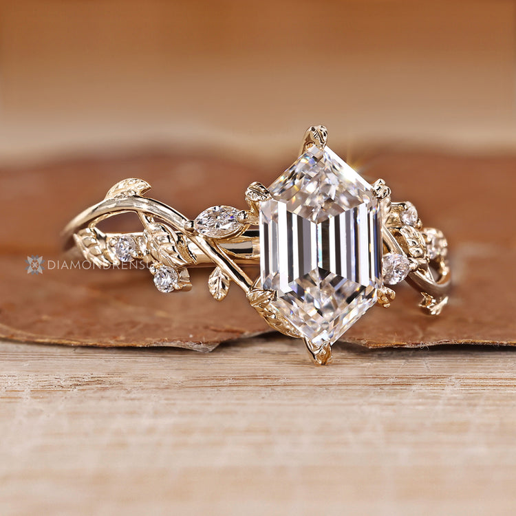 IGI certified hexagon diamond ring with leaf style prong setting.