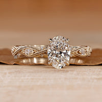 Vintage oval diamond ring with milgrain details.