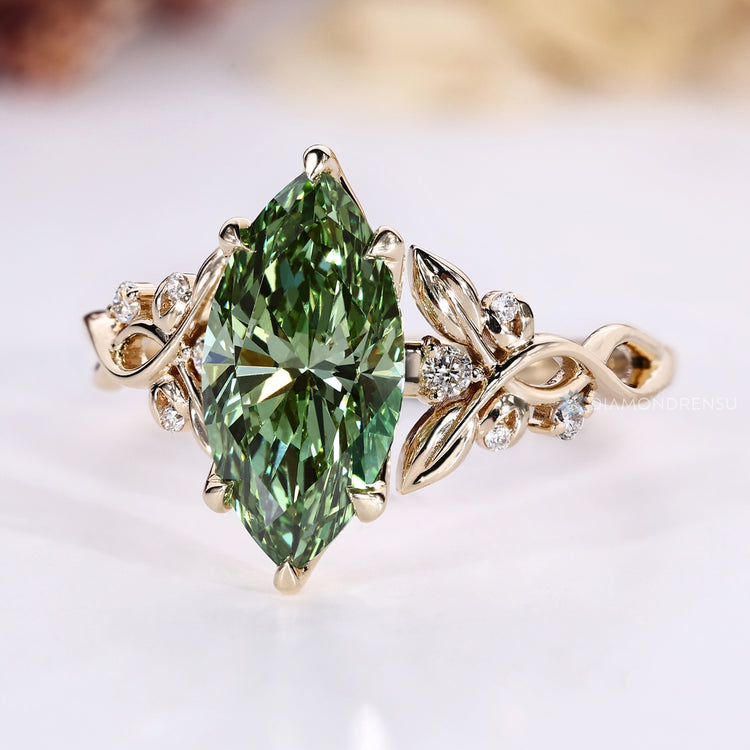 Green marquise center stone with a twisted shank.