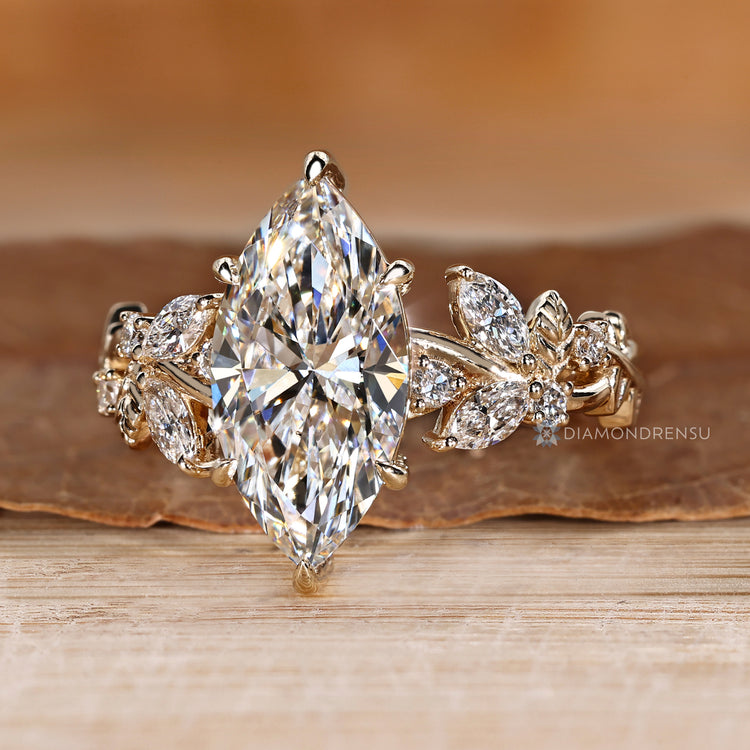 Nature inspired engagement ring with a six claw prong setting.