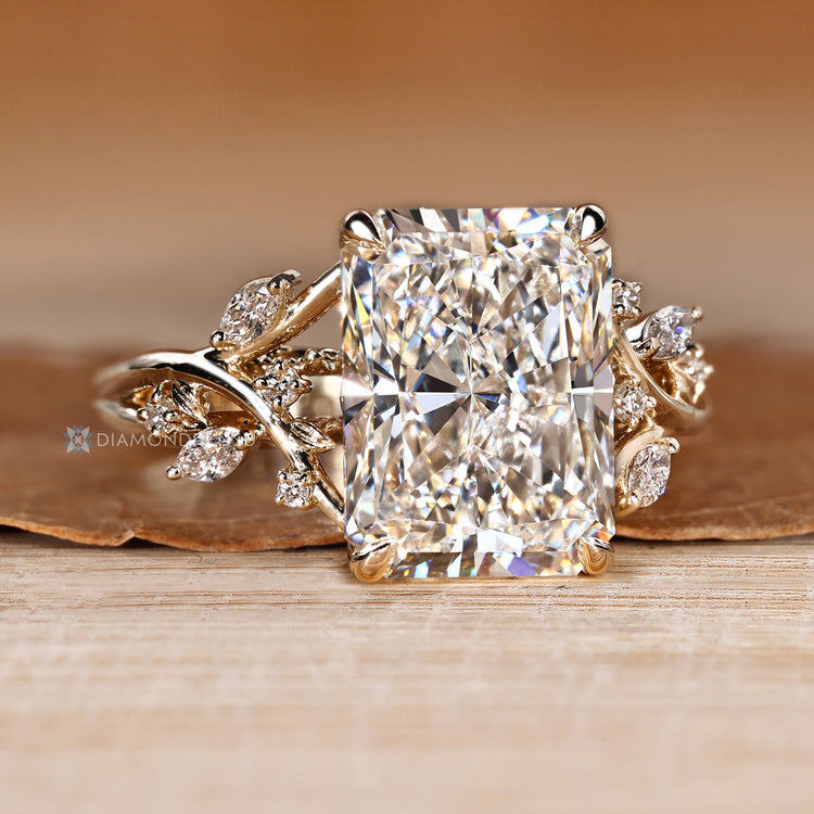 Radiant lab grown diamond ring with four claw prongs.