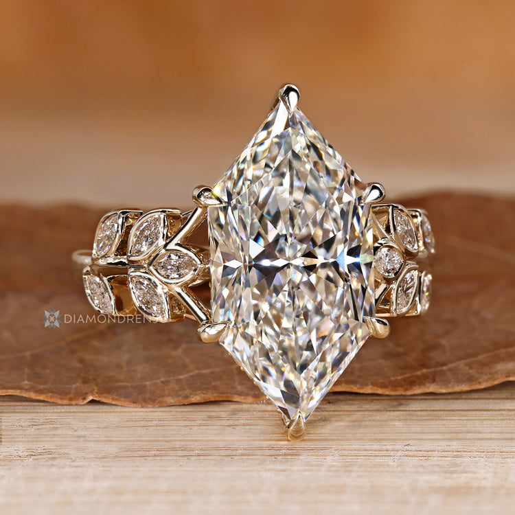 Dutch marquise engagement ring with round stones in a hidden halo.