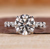 Hidden halo diamond ring with round center.

