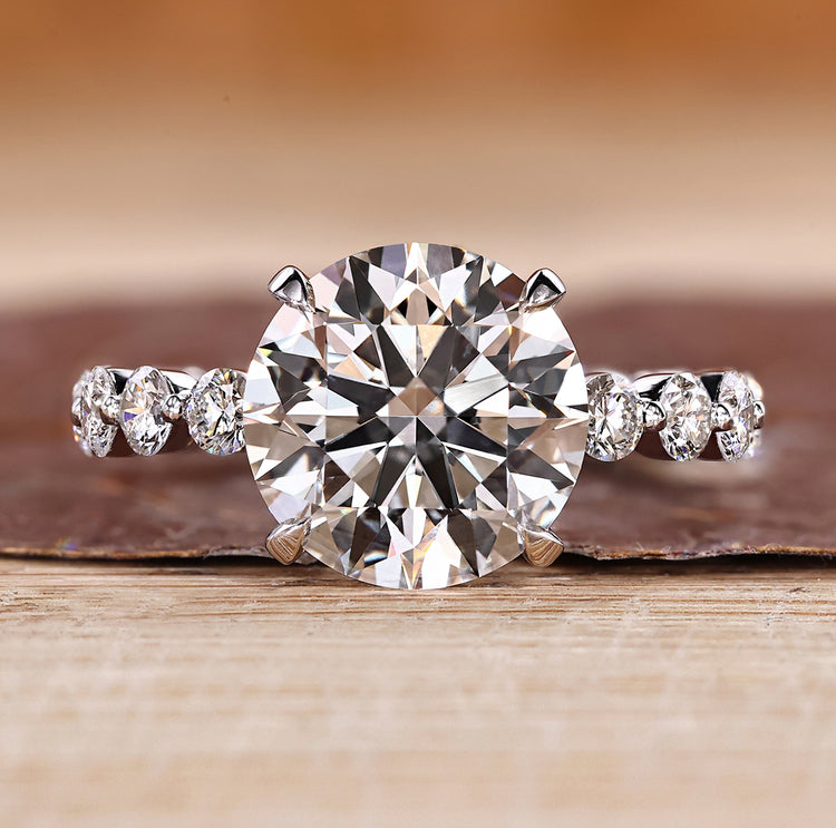 Hidden halo diamond ring with round center.

