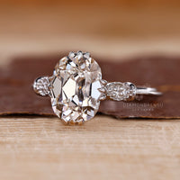 Vintage style diamond ring with fishtails prong and milgrain accents.
