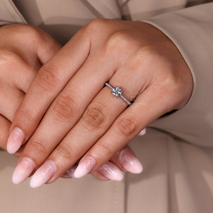 Lab grown round diamond ring with four prong design.