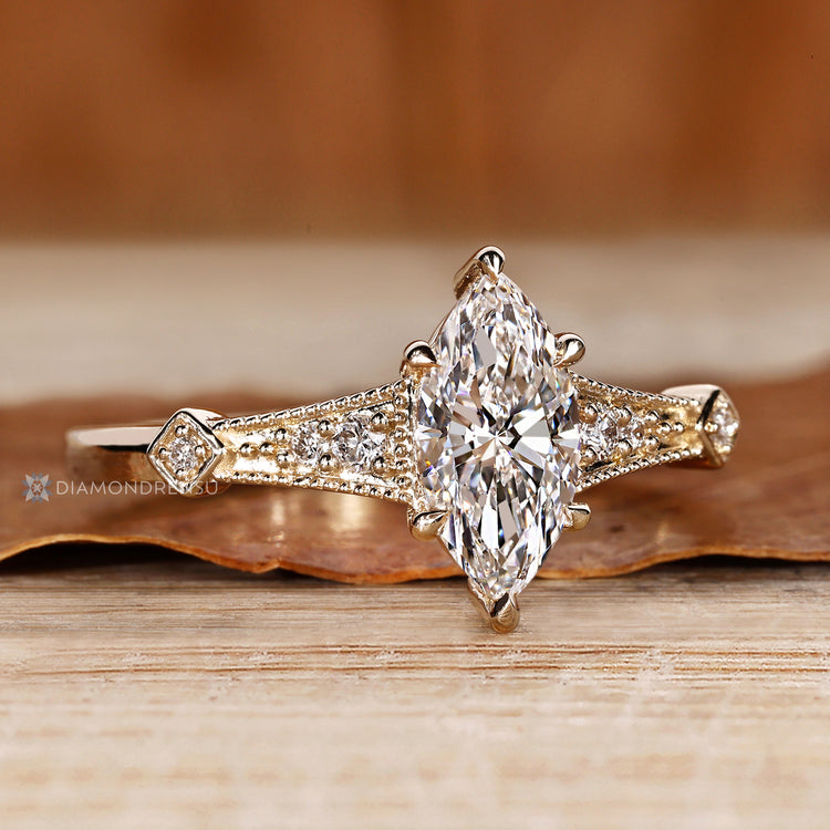 IGI certified marquise diamond ring with six claw prong setting.