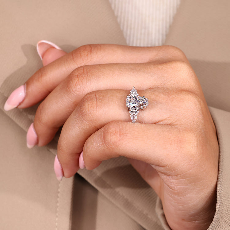 Coffin cut engagement ring with tapered shank design.