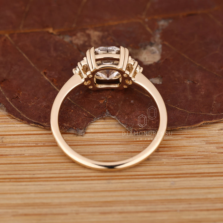 Cushion OMC diamond engagement ring with elegant muse setting.
