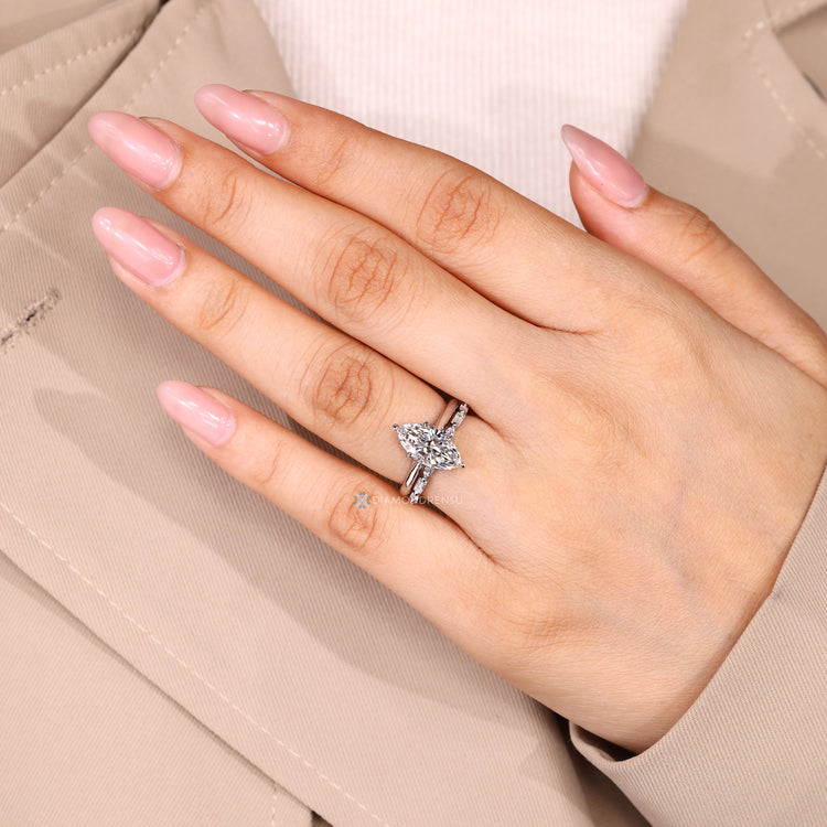 Stackable marquise wedding ring with shared prong setting.