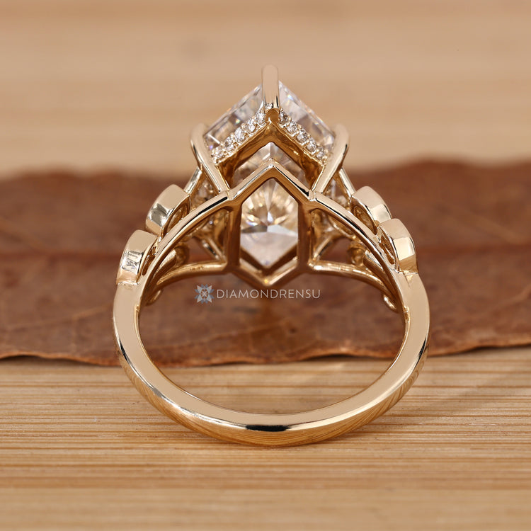 Dutch marquise engagement ring with marquise side stones and a cluster setting.