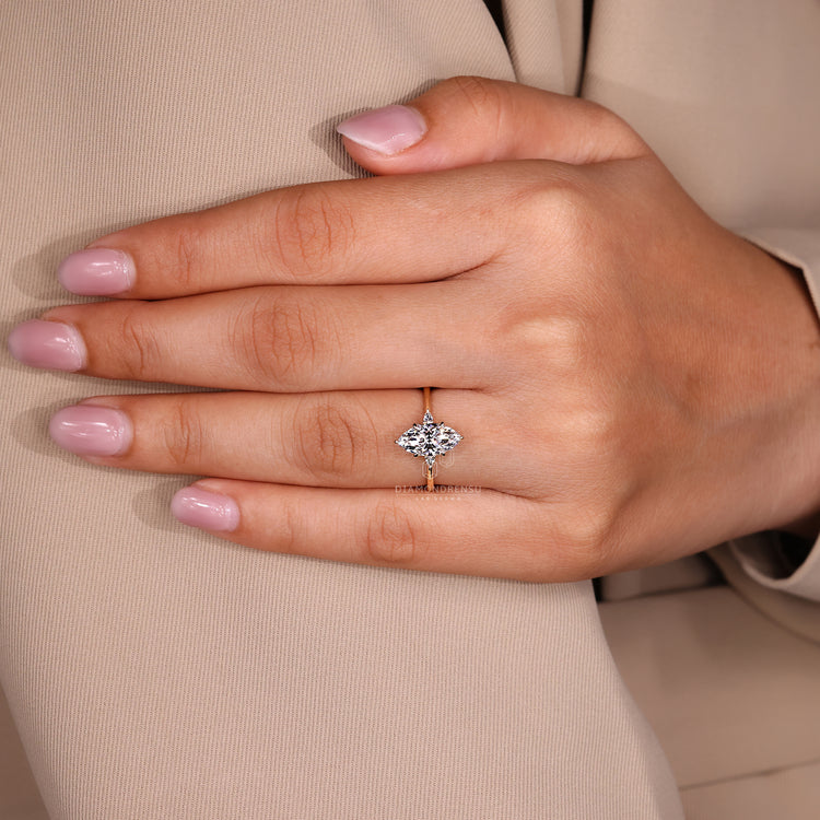 IGI certified three stone marquise and pear diamond ring.