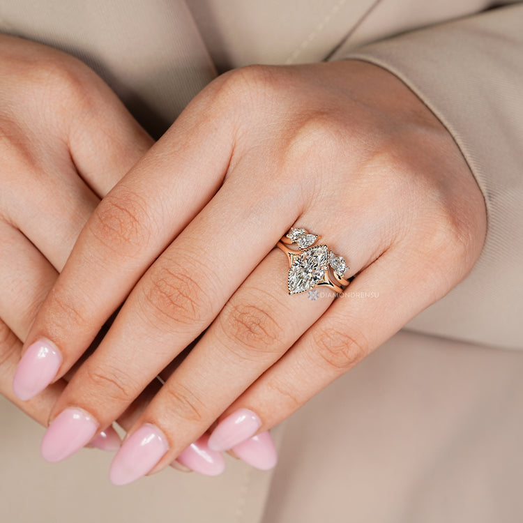 Marquise bridal set with a round, pear, and marquise band.