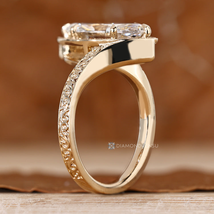 Art deco marquise ring with round diamond halo.