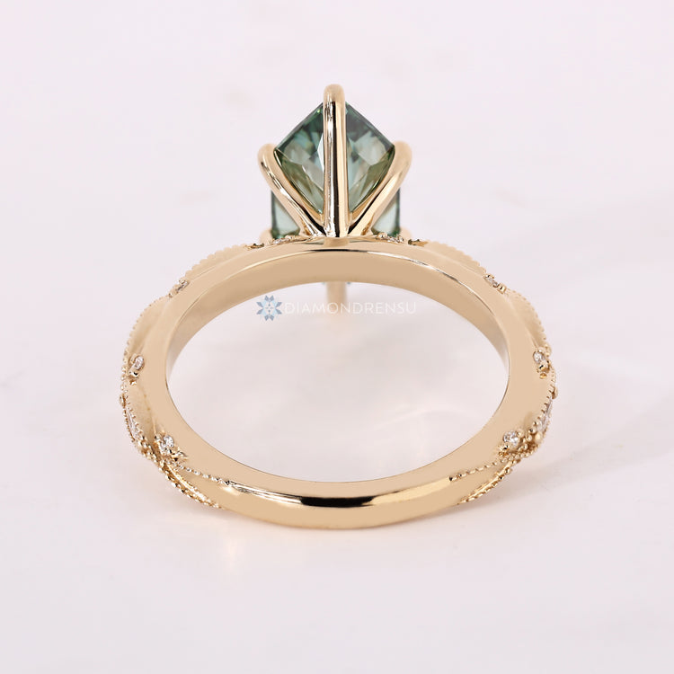 Dutch marquise diamond ring with round and marquise cut pavé details.