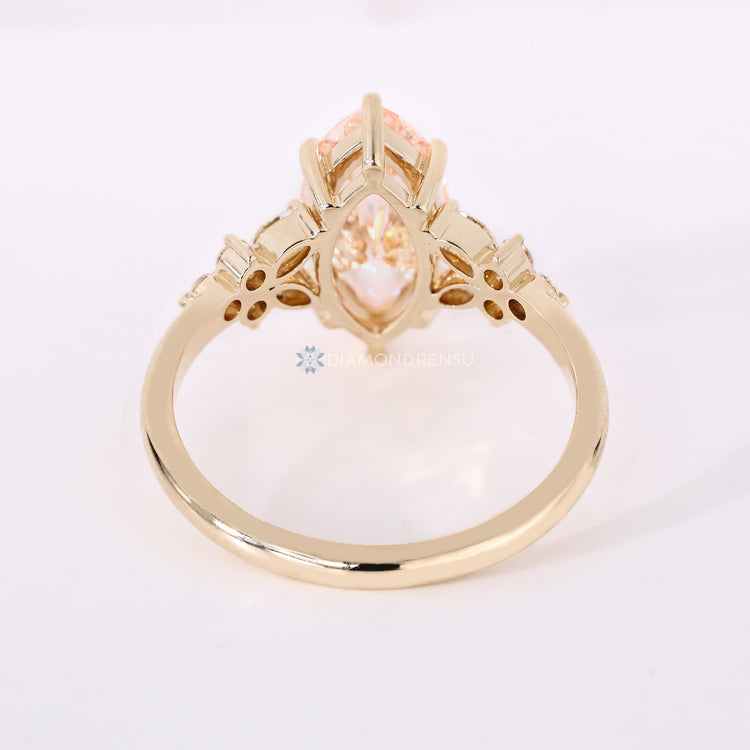Marquise ring with round and marquise diamond accents.