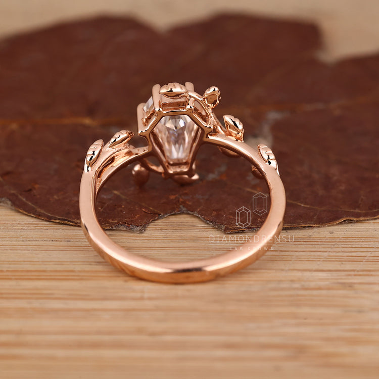 Handmade solitaire coffin diamond ring with artistic styling.