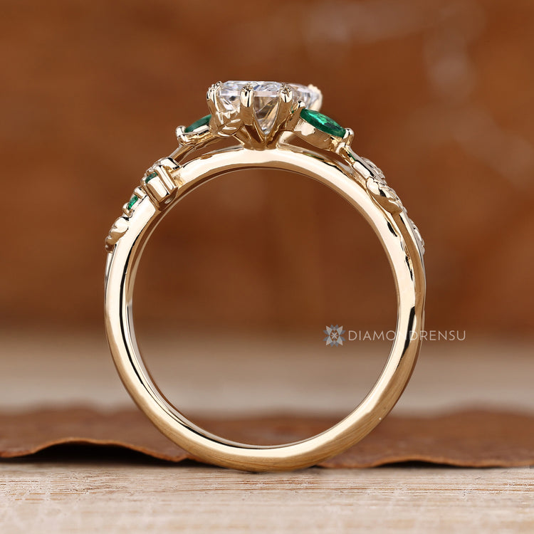 Nature inspired engagement ring with six leaf style prongs.
