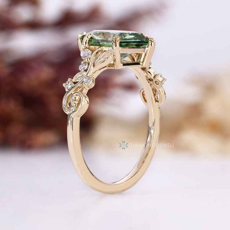Green Dutch marquise engagement ring with six leaf style prongs.