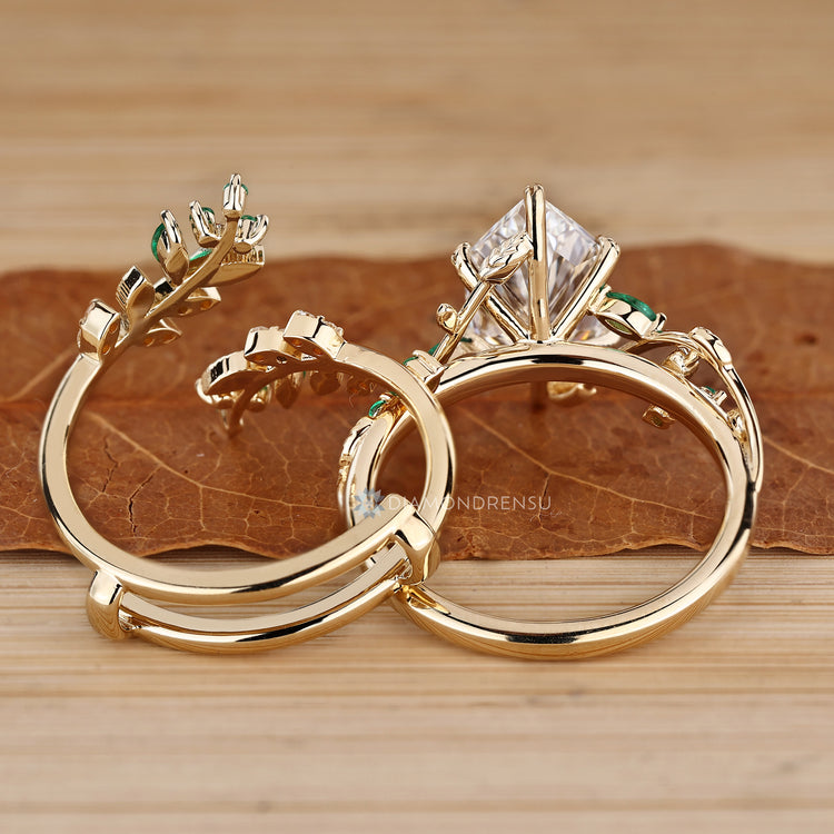 Stackable bridal set with marquise and round cut green emeralds.