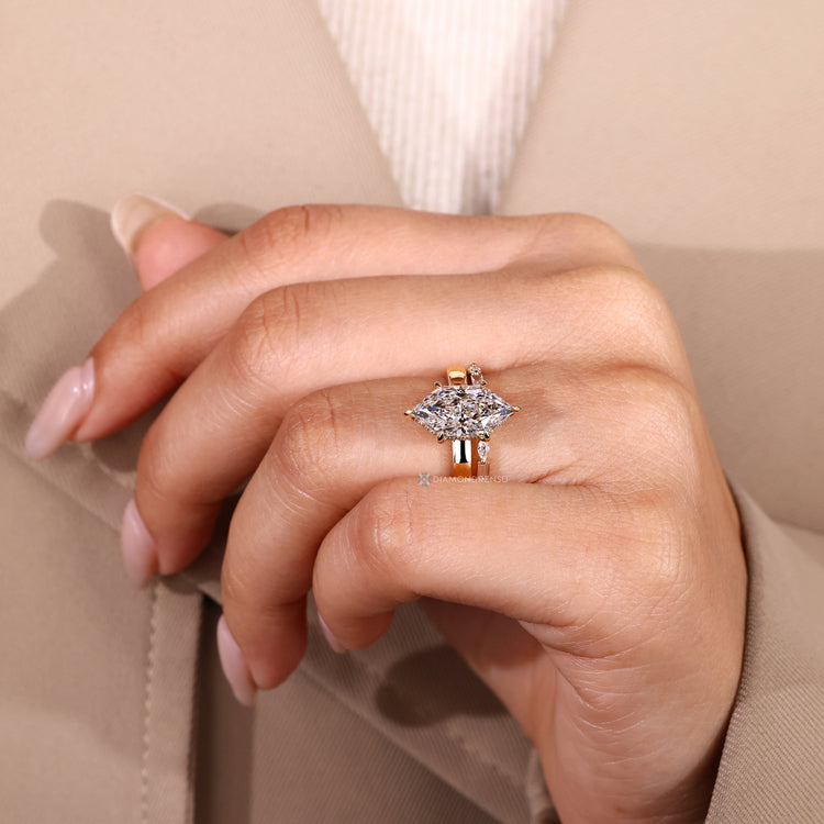 Full eternity band enhances this Dutch marquise wedding ring.