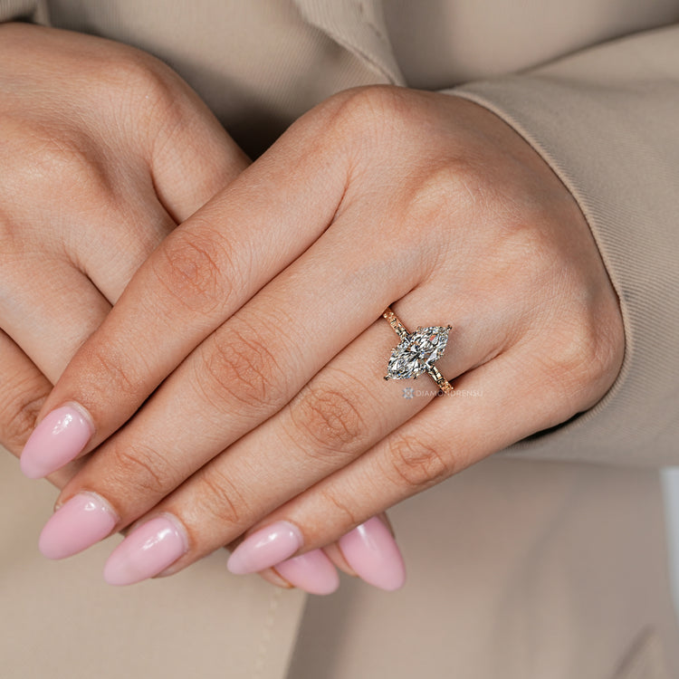 Marquise center stone with a solitaire style setting.