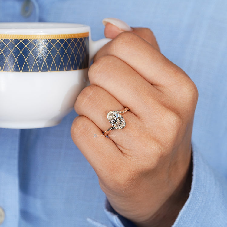 Art Deco oval diamond ring with a bypass setting.