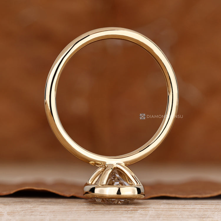 IGI certified lab grown diamond bezel engagement ring.