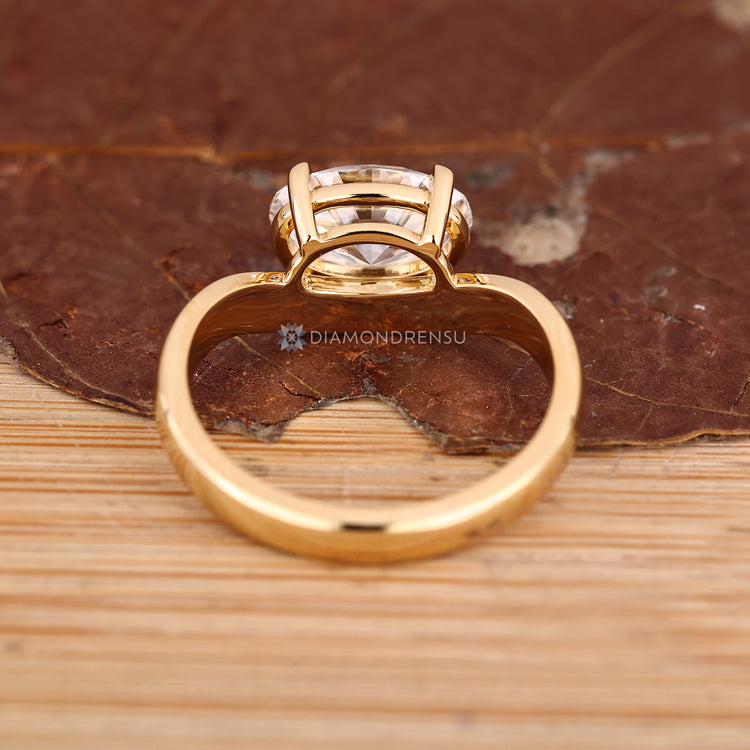 Handmade oval ring with pinky style and curved shank.