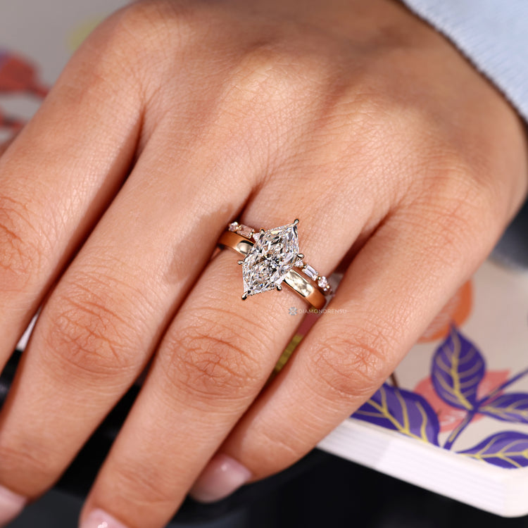 Round cut hidden halo complements this Dutch marquise wedding ring.