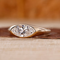 Marquise Cut Engagement Ring in Gypsy Setting