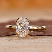 IGI certified oval diamond ring with hidden diamond accents.