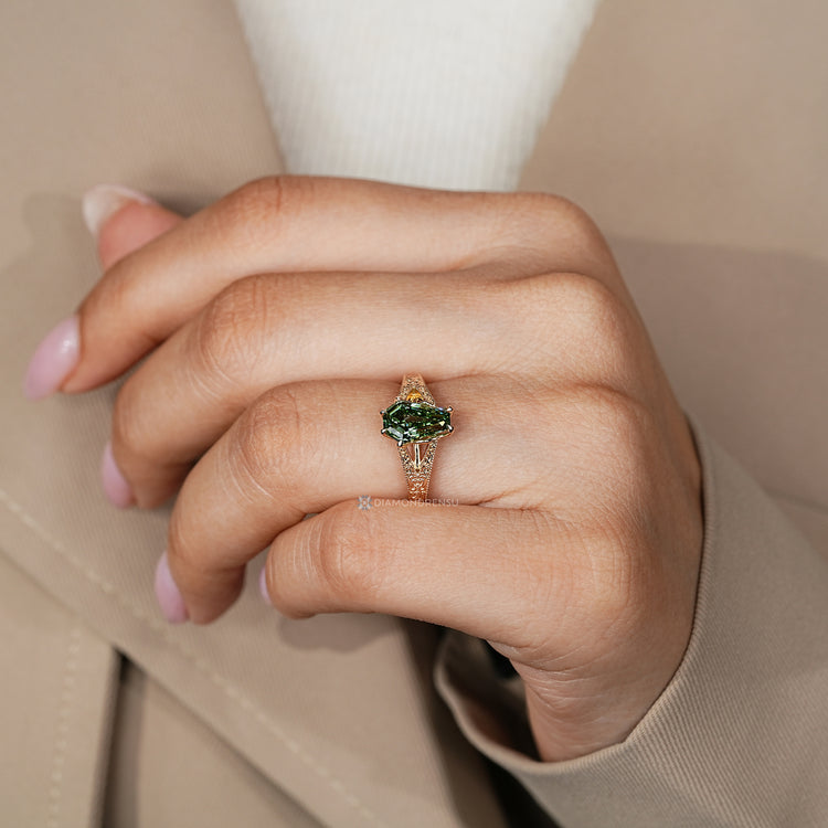 Green coffin cut diamond ring with a tulip setting.
