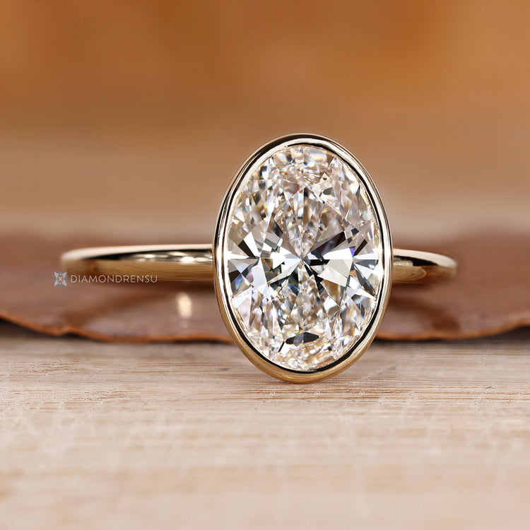 Oval cut diamond ring in a solitaire style.