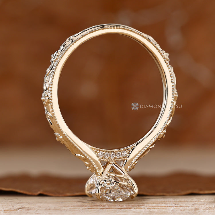 Art Deco oval solitaire ring with a cathedral setting.