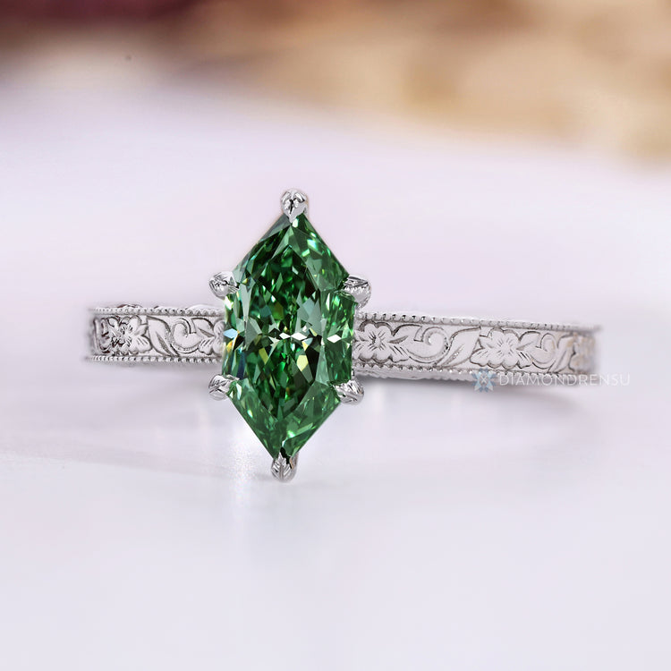Green Dutch marquise diamond ring with milgrain details.