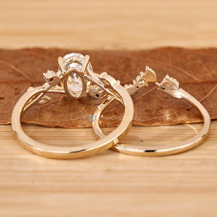 Nature inspired oval bridal set with marquise side stones.