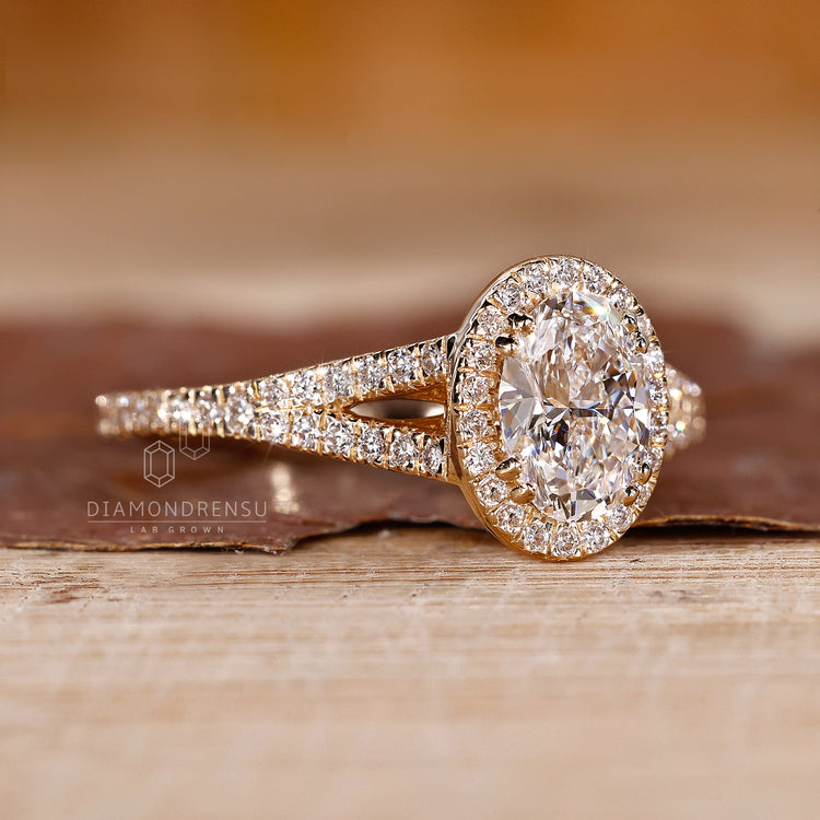 IGI certified oval diamond engagement ring with halo design.