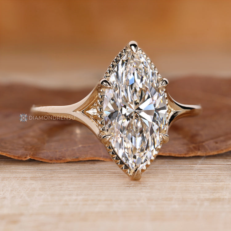 Marquise diamond ring with a six claw prong setting.