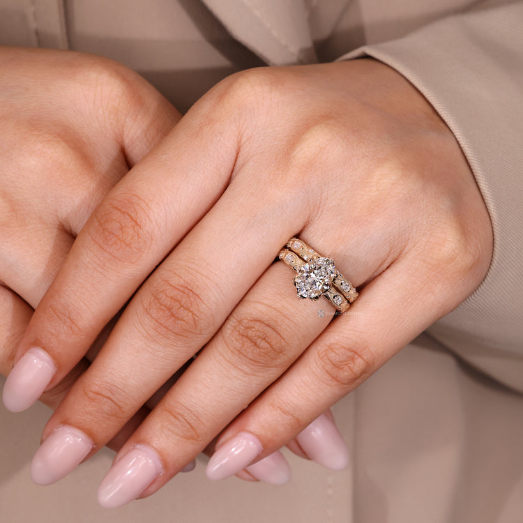 Oval bridal set with four claw prong setting and stackable band.