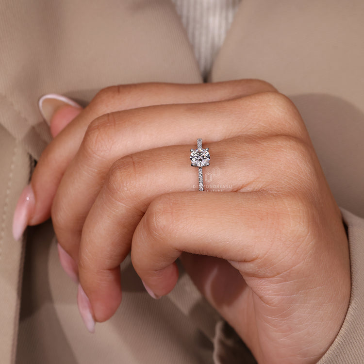 IGI certified round diamond ring with tapered shank and pave accents.