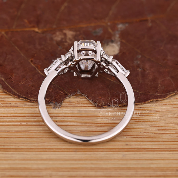 Handmade seven stone ring with muse setting details.