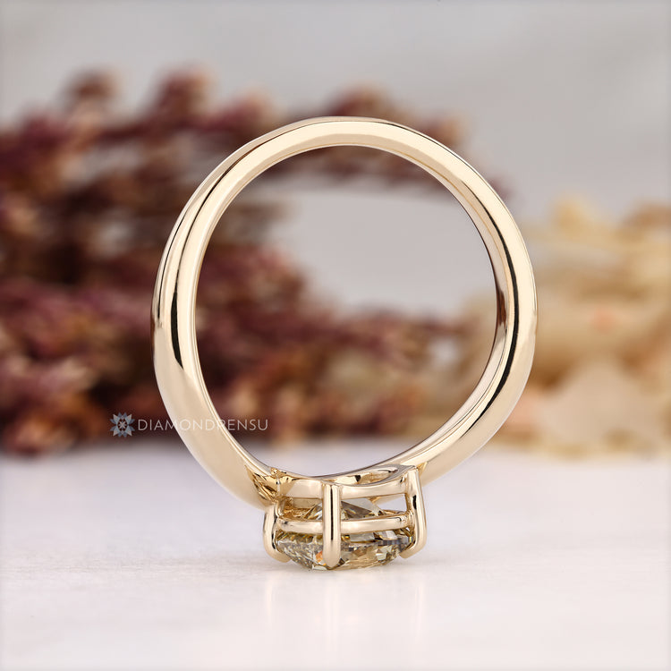 Four claw prong setting complements the cushion old mine cut ring.