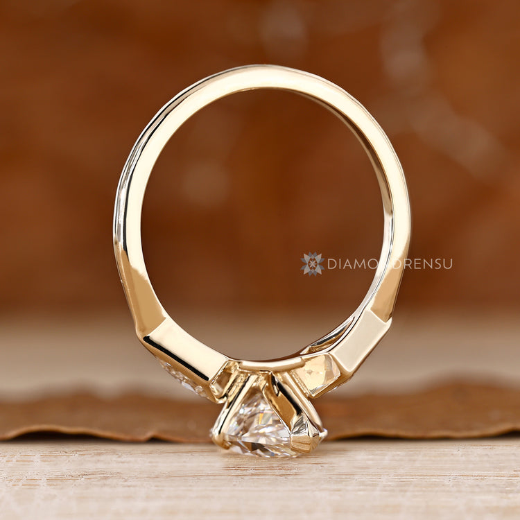 Three stone Dutch marquise diamond ring with kite side stones.