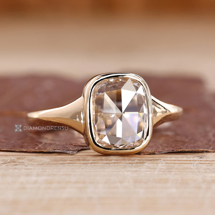 IGI certified cushion rose cut diamond ring with bezel setting.